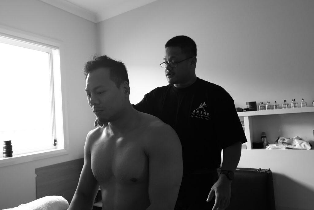 Remedial Massage Therapist Anthony providing treatment to a client at Amend Massage Therapy Preston NSW 2170.